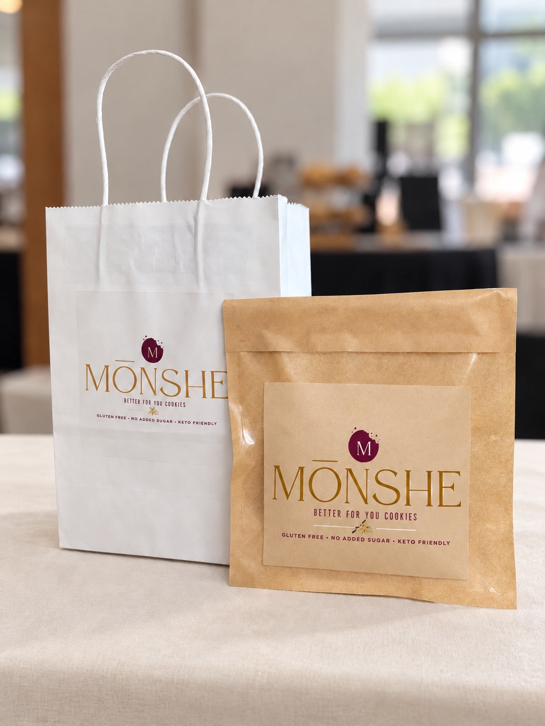 Monshe branded white bag and kraft cookie pouch