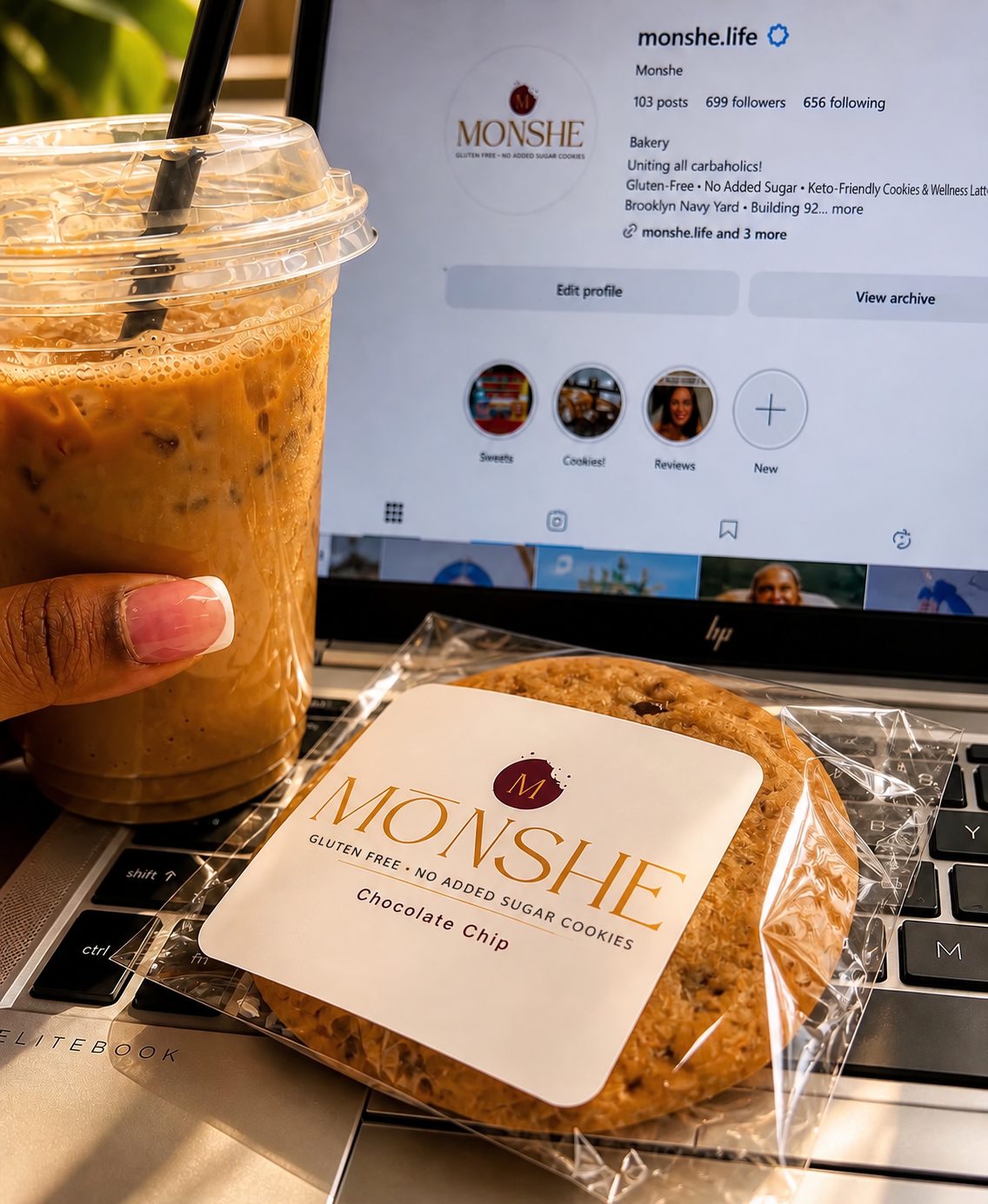 Individually wrapped Monshe Chocolate Chip cookie with no-added-sugar labeling beside iced coffee